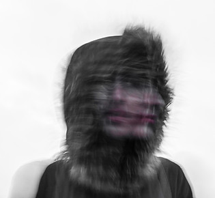blurred face of confused person
