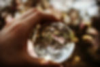Crystal ball in hand used for developing psychic senses
