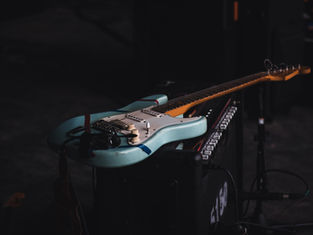 Which teams do Oasis, The Rolling Stones and The Arctic Monkeys support?