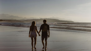 Couple walking together on a beach