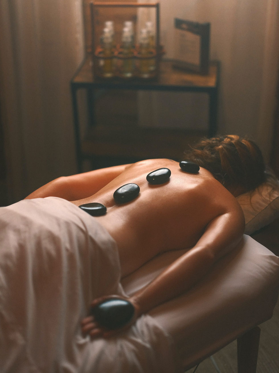 Eye-level view of elegant spa interior with soft lighting and comfortable seating