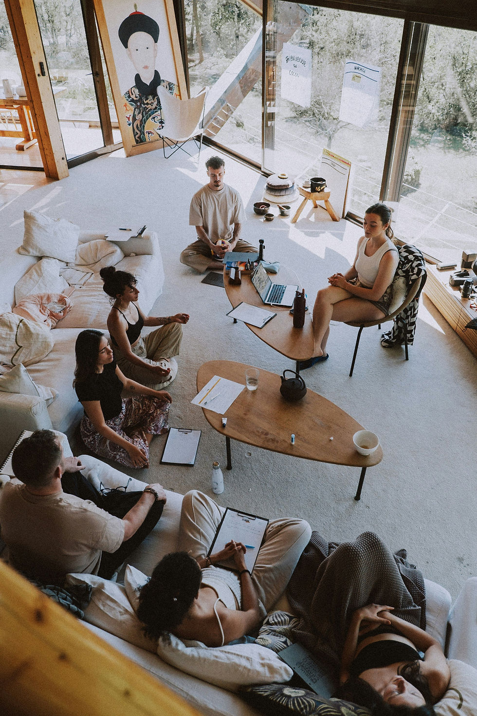 Group in a bright studio during retreat planning.