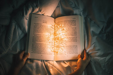 a dungeons and dragons book open in a dark room
