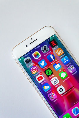 Smartphone displaying popular social media apps, encouraging users to follow Think Ripple @ThinkRippleUK for insights, updates, and industry news.