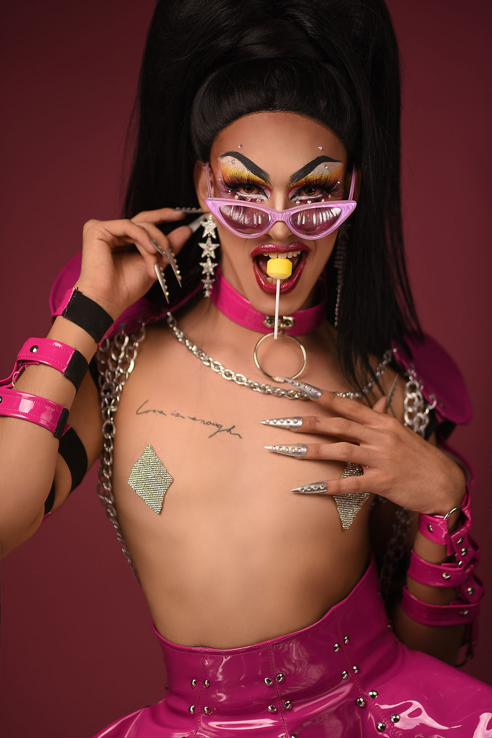 drag queen honey. very big BDSM club fixture vibes