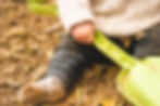 Baby holding a plastic shovel