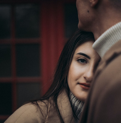 woman leaning on to another person