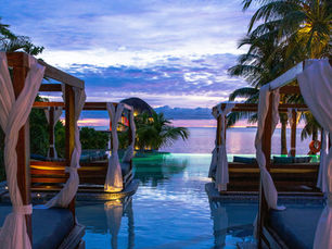 Cabanas around pool in a oceanside resort