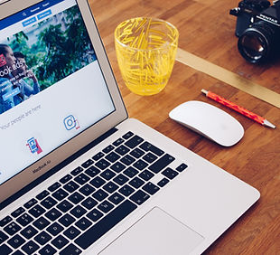 Image by Will Francis: Laptop with a mouse, pencil, camera and glass next to it. Ready to tackle SEO and PPC.