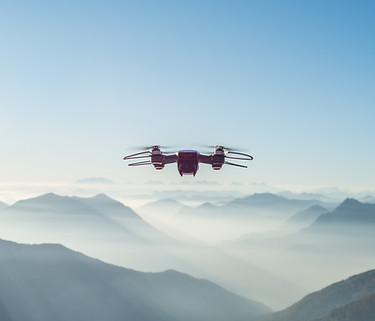 Drone in flight representing OTA solutions for real-time updates in IoT and autonomous systems.