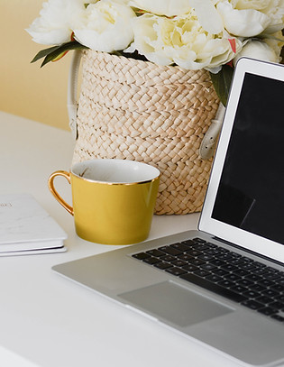Laptio and mug set up for a virtual call