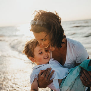 Making memories by the seaside: A joyful moment of travel with kids as the sun sets on another adventure.
