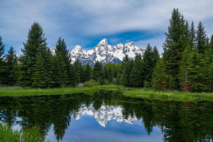 mountains with snow and river in foreground