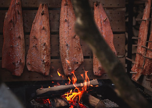 Salmon smoking over fire