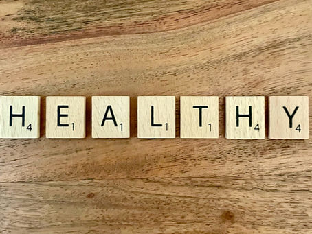 Scrabble tiles that spell healthy, promoting healthy habits with NoCo Wellness