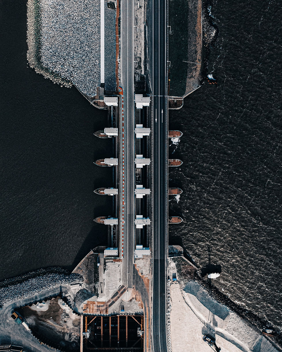 Check out this awesome aerial shot of the Afsluitdijk! It's an engineering wonder, linking two pieces of land over the water.