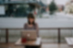 Woman using outside on bench