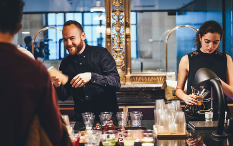 Bartenders Serving Guests