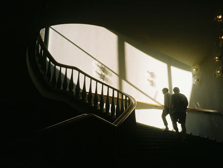 2 people walking up steps