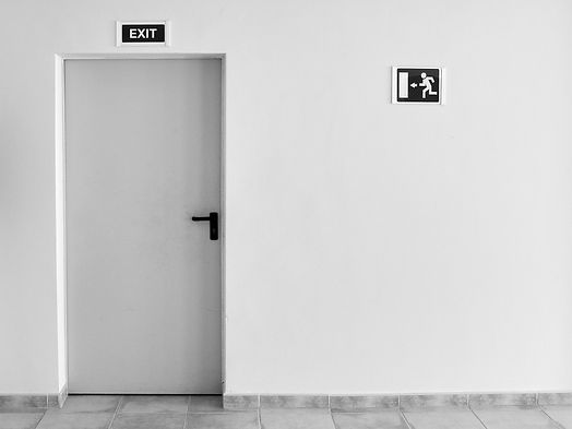 Emergency exit corridor with signage after fire door installation.