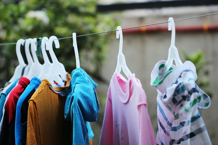 A clothes line with clothes hanging to dry