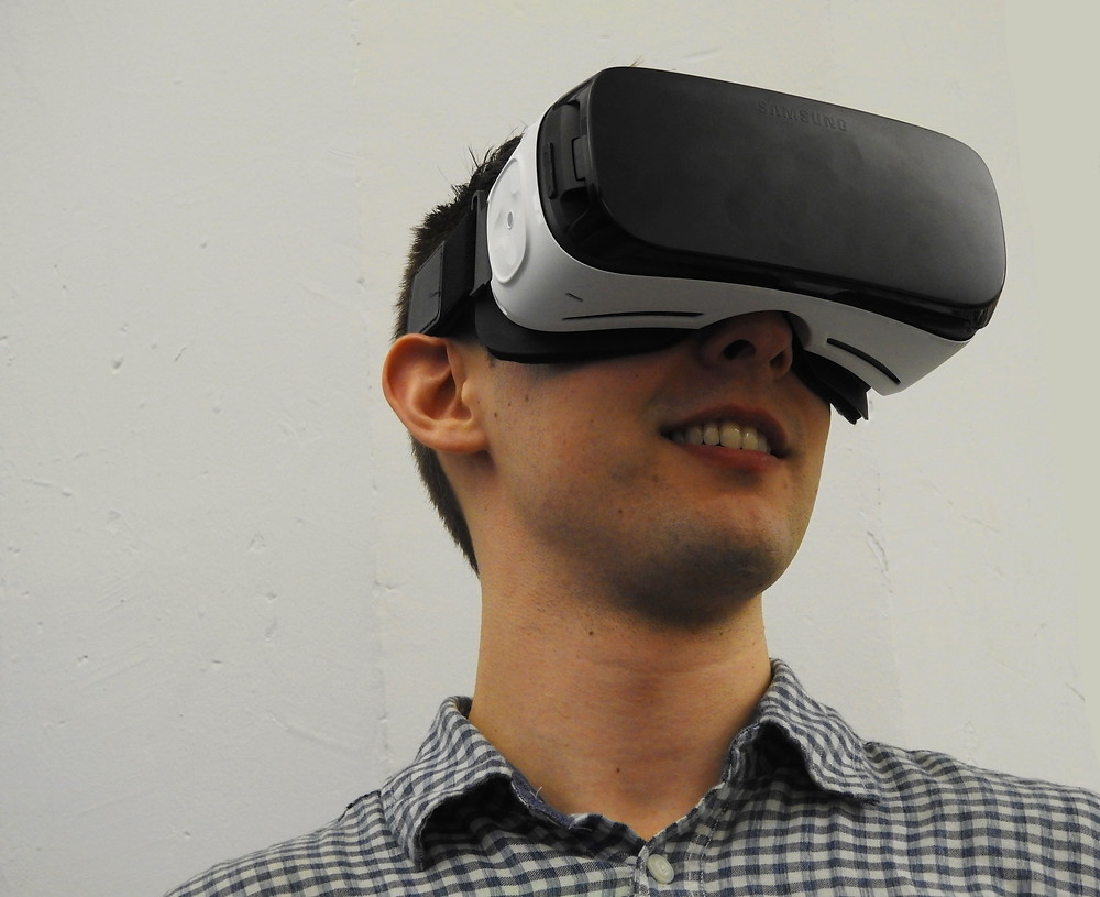 A person playing with a VR headset.