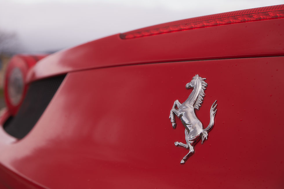 Ferrari badge on red car