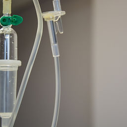 A cropped shot of an IV drip in a hospital room.
