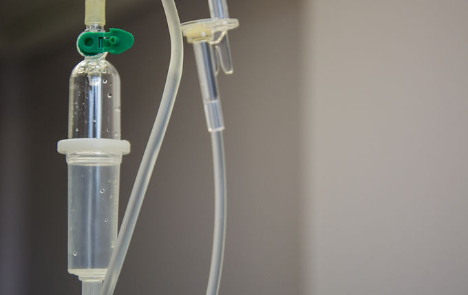 A cropped shot of an IV drip in a hospital room.