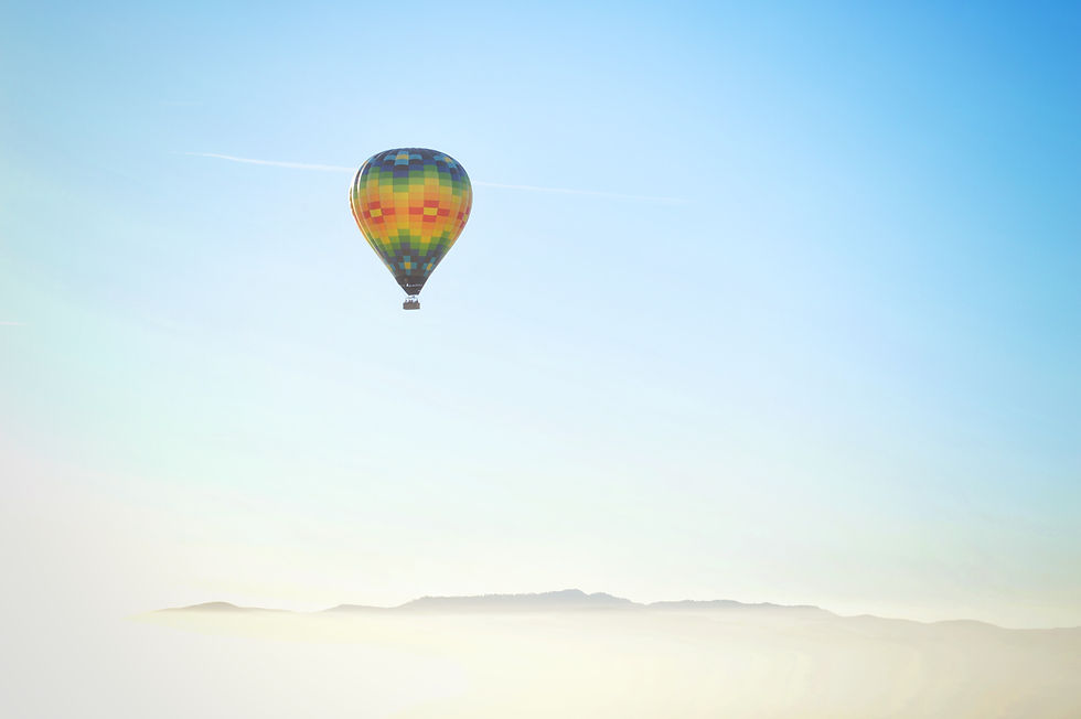 Balloon soaring in a blue sky