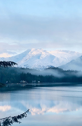 Alaskan mountains with calm water Image by Kathrine Coonjohn