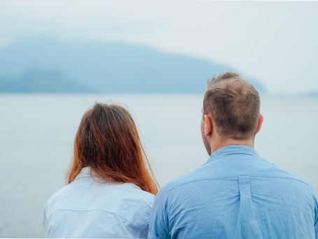 a couple looking out at the ocean