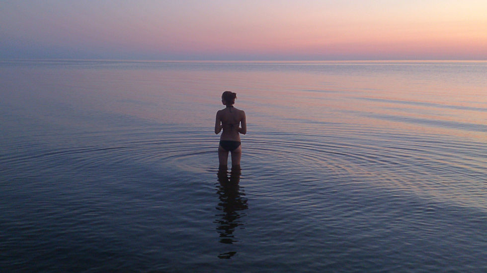 woman standing alone in water