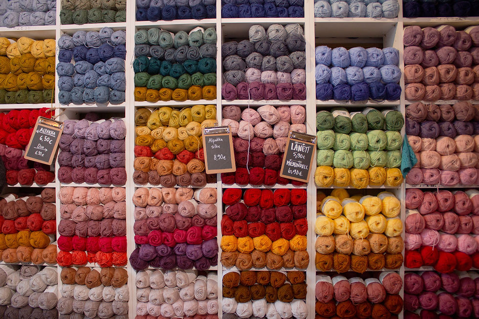 wall of various colours of yarn