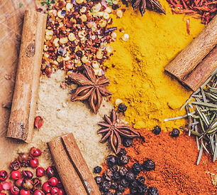 Flat lay of spices and cinnamon sticks