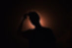 Silhouette of a person holding their head against an orange backlight. Can this person or you put your critical thinking skills to the test?