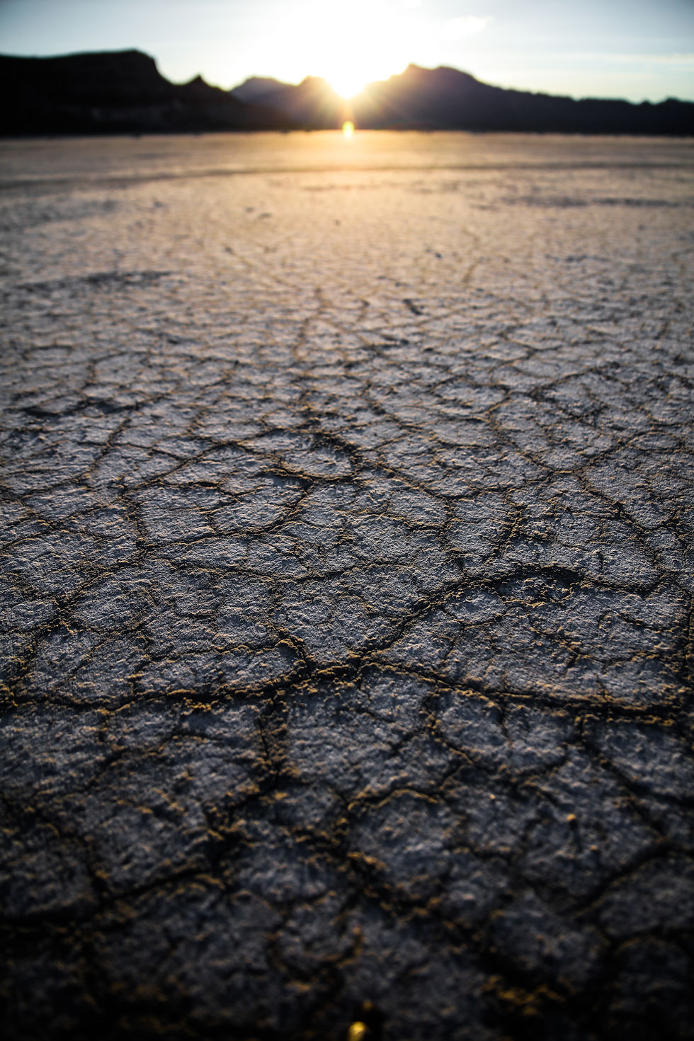 Sunsetting behind mountains in the dessert