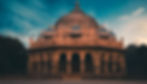 The octagonal tomb of Isa Khan with eight blue-tiled chattri domes is a visual delight