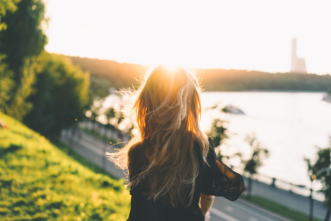 A woman looking out at water