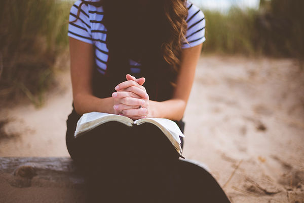 praying on beach