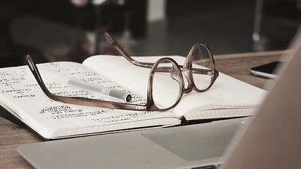 Readung glasses laying on an open book