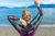 a female triathlete unzipping her wetsuit