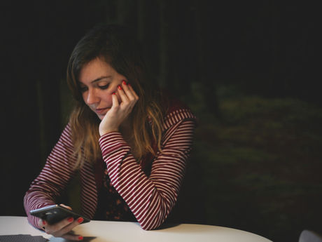 woman waiting by the phone