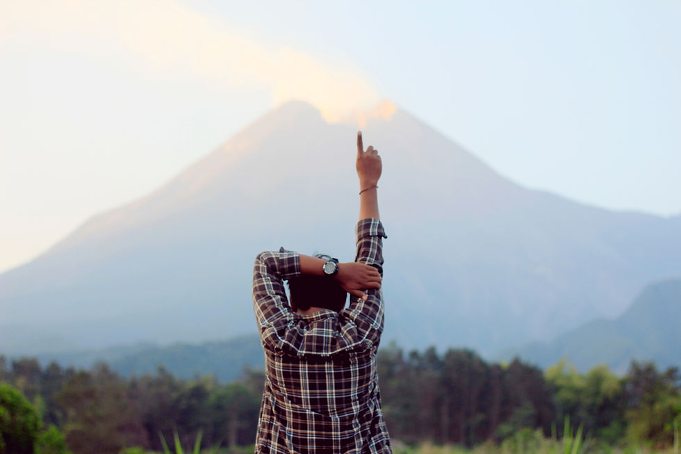 Man standing with finger pointed in the air