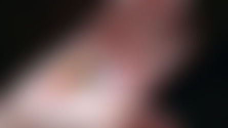 A hand holding several brightly colored stars, each a different color, symbolizing the concept of diversification in investing by representing a variety of choices or assets.