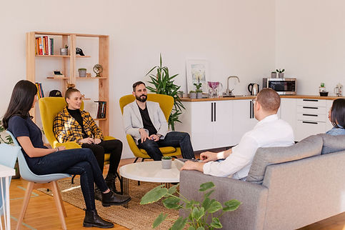 an executive coach giving a class in a casual setting on leadership
