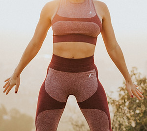 Image by MARK ADRIANE_ Woman with sport bra and long leggings