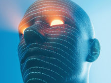 A futuristic blue humanoid head with glowing orange eyes. Patterns of text cover the face in a digital style, set against a blue gradient background.