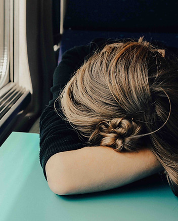 Exhausted woman on a train