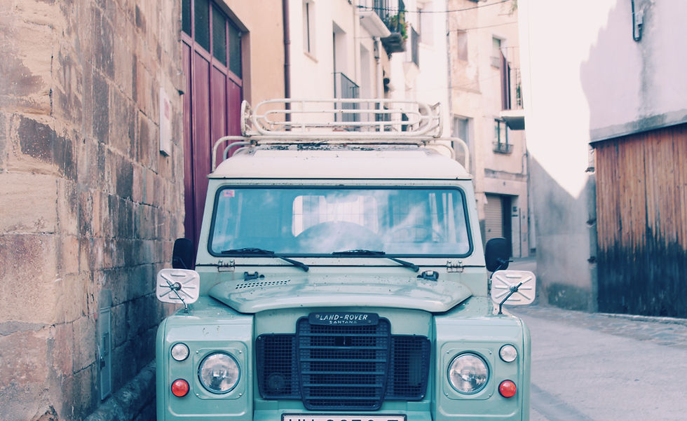 A classic Land Rover Santana parked in a Spanish street